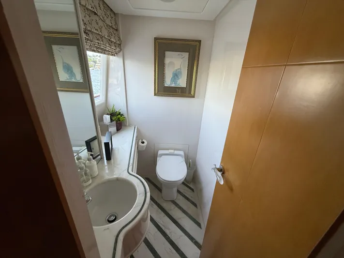 Arrivederci IV Yacht Photos Pics Bathroom interior of 1998 Cantieri di Pisa AKHIR yacht, featuring modern fixtures and decor.