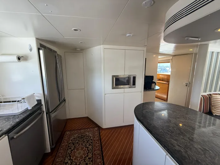 Arrivederci IV Yacht Photos Pics Luxurious 1998 Cantieri di Pisa AKHIR yacht interior with modern kitchen design.