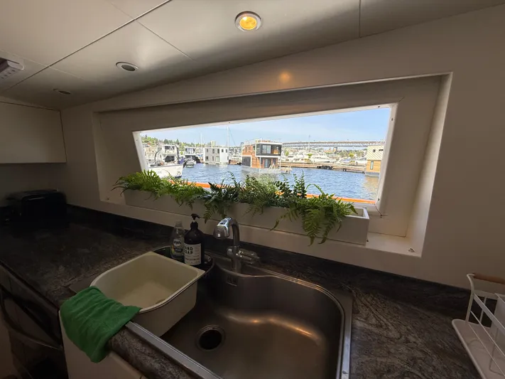 Arrivederci IV Yacht Photos Pics Kitchen sink with marina view on 1998 Cantieri di Pisa AKHIR yacht.