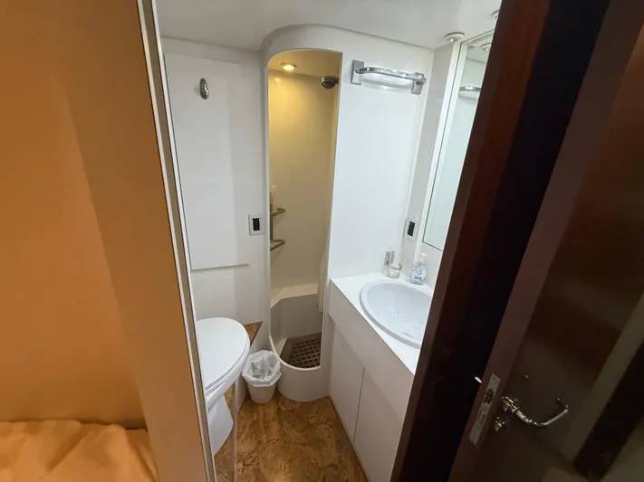 Arrivederci IV Yacht Photos Pics Bathroom interior of 1998 Cantieri di Pisa AKHIR yacht, featuring sink, toilet, and shower.