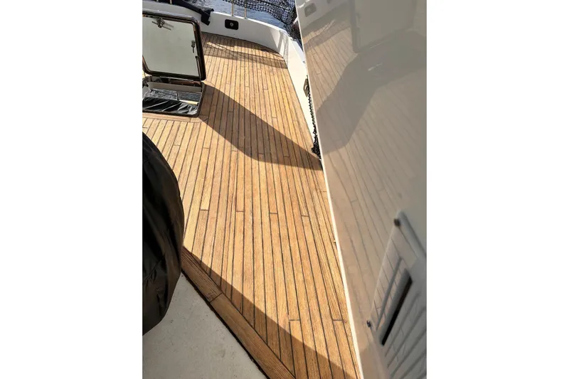 85 Azimut Ultimate Yacht Photos Pics Teak deck of 1999 Azimut 85 Ultimate yacht, showcasing elegant wood finish.