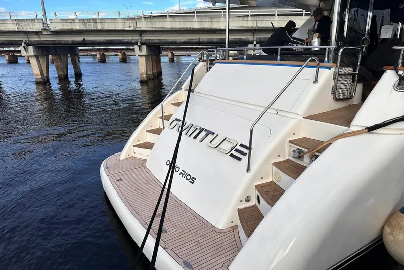 85 Azimut Ultimate Yacht Photos Pics 1999 Azimut 85 Ultimate yacht docked near a bridge, rear view.