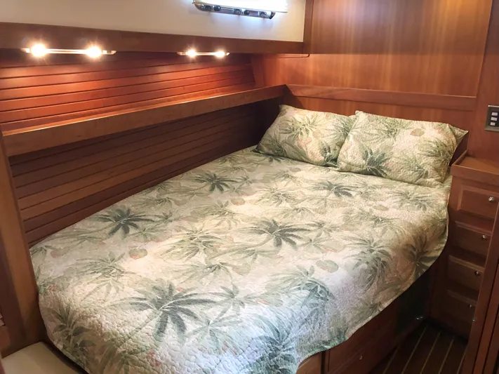 Southern Charm Yacht Photos Pics Cozy bedroom in 2010 Sabre 40 Sedan with tropical-themed bedding.