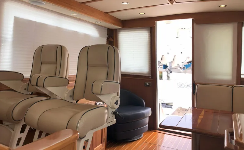 Southern Charm Yacht Photos Pics Interior of 2010 Sabre 40 Sedan yacht with beige seating and wooden accents.