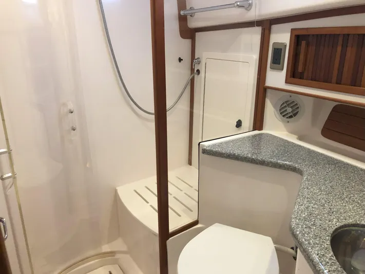 Southern Charm Yacht Photos Pics 2010 Sabre 40 Sedan bathroom with shower, toilet, and countertop.