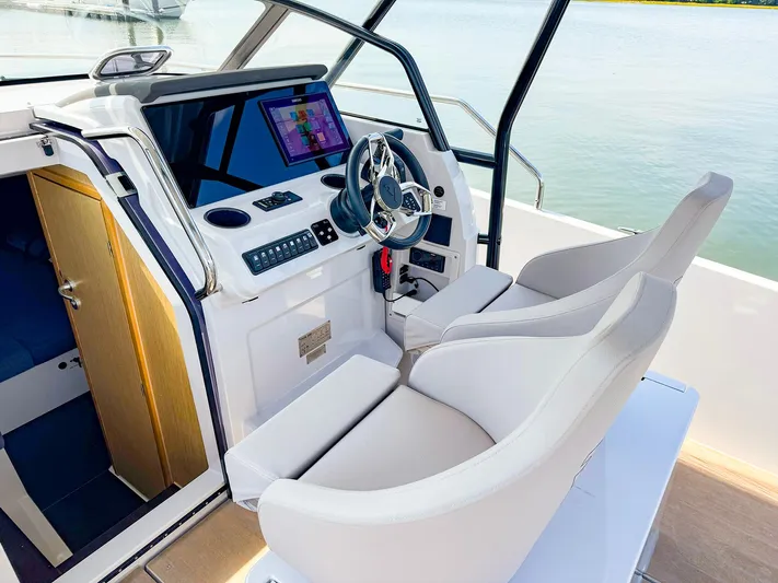 4787mm Yacht Photos Pics 2023 RYCK 280 boat cockpit with modern steering and navigation system.