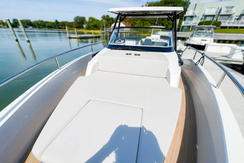 4787mm Yacht Photos Pics 2023 RYCK 280 boat with spacious deck, docked in a serene marina.