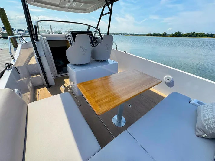 4787mm Yacht Photos Pics RYCK 280 boat interior with seating and table, 2023 model, docked by a serene lake.
