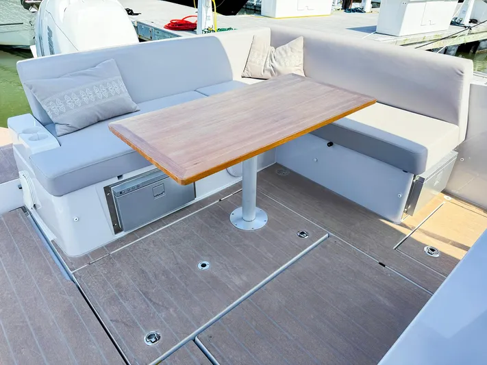 4787mm Yacht Photos Pics RYCK 280 boat interior with cushioned seating and wooden table, 2023 model.