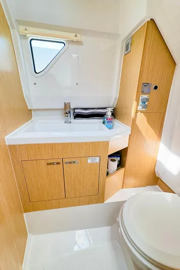 4787mm Yacht Photos Pics Modern bathroom in 2023 RYCK 280 boat with wood accents and compact design.