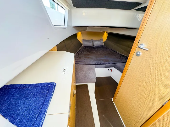 4787mm Yacht Photos Pics Interior cabin of 2023 RYCK 280 boat with cozy bed and wooden accents.