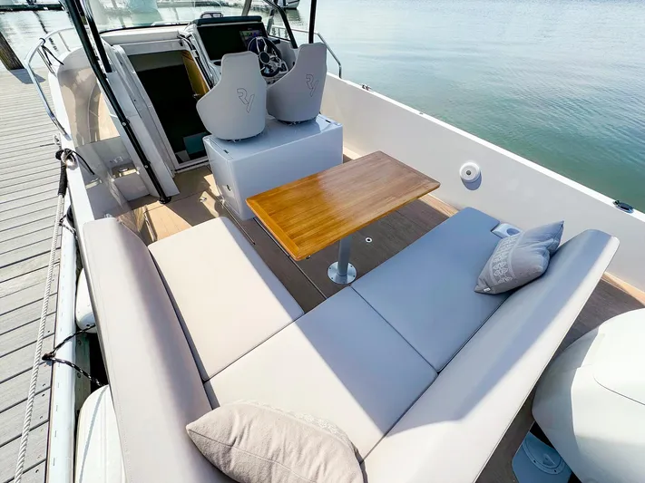 4787mm Yacht Photos Pics RYCK 280 boat interior with cushioned seating and wooden table, 2023 model.