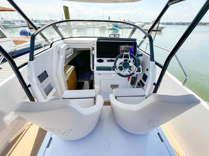 4787mm Yacht Photos Pics RYCK 280 boat cockpit with modern steering and navigation system, 2023 model.