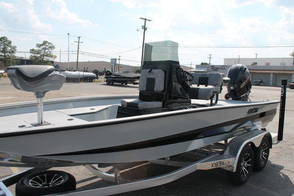 2026 Excel Bay Pro Elite 203 boat on trailer, parked outdoors, featuring sleek design and modern equipment.
