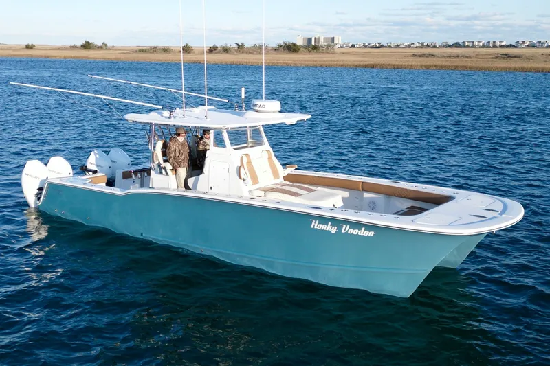  Yacht Photos Pics 2022 Tideline 365 Offshore boat on water, featuring dual outboard motors.