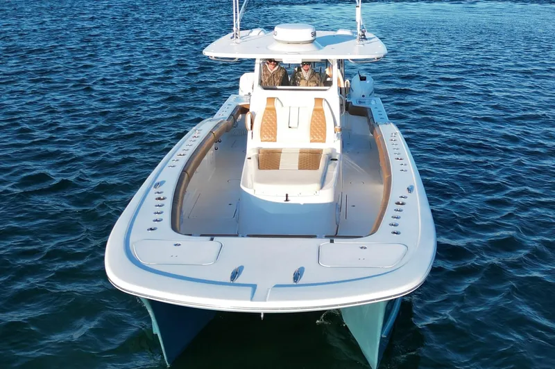  Yacht Photos Pics 2022 Tideline 365 Offshore boat cruising on open water.