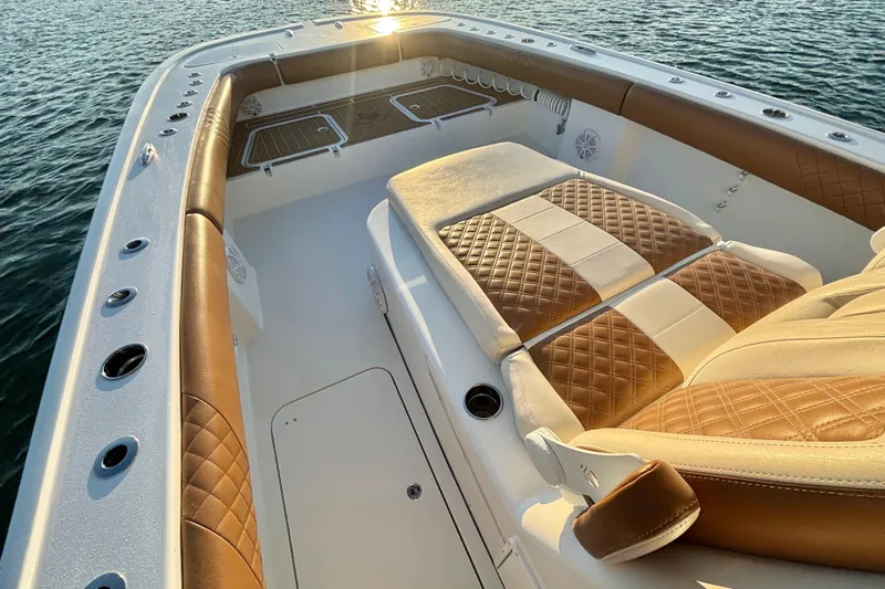  Yacht Photos Pics Luxurious interior of 2022 Tideline 365 Offshore boat with quilted seating.