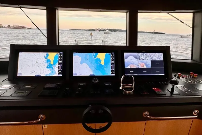  Yacht Photos Pics 2024 Explorer ICE yacht cockpit with navigation screens and ocean view.