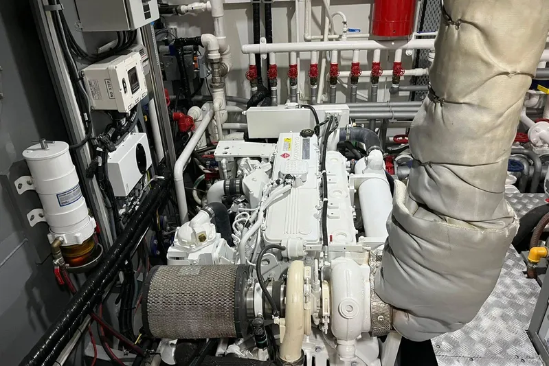  Yacht Photos Pics 2024 Explorer ICE engine room with complex piping and machinery.