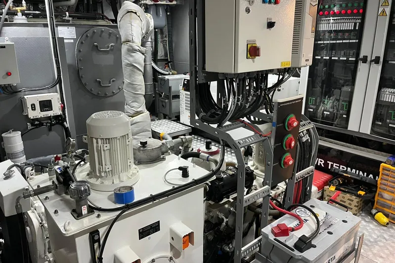  Yacht Photos Pics 2024 Explorer ICE engine room with machinery, control panels, and wiring.
