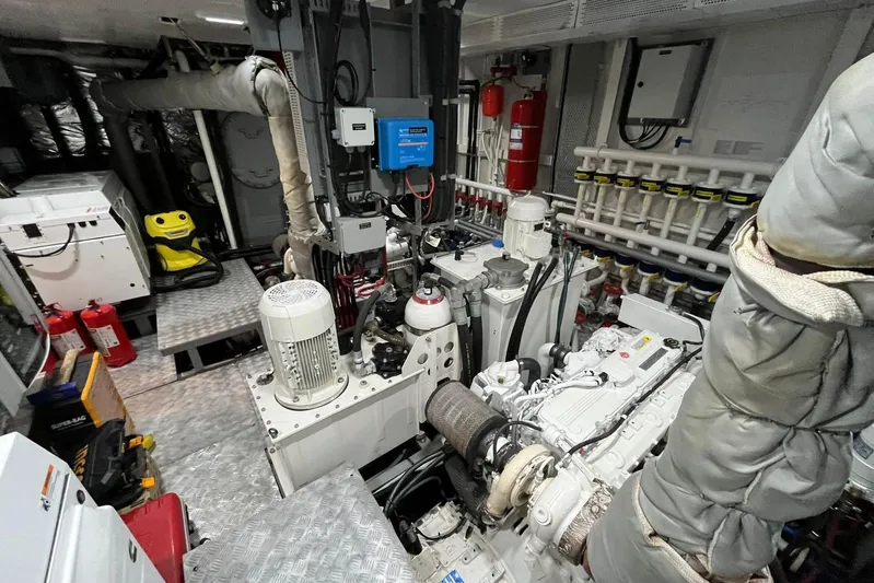  Yacht Photos Pics 2024 Explorer ICE engine room with machinery, pipes, and safety equipment.