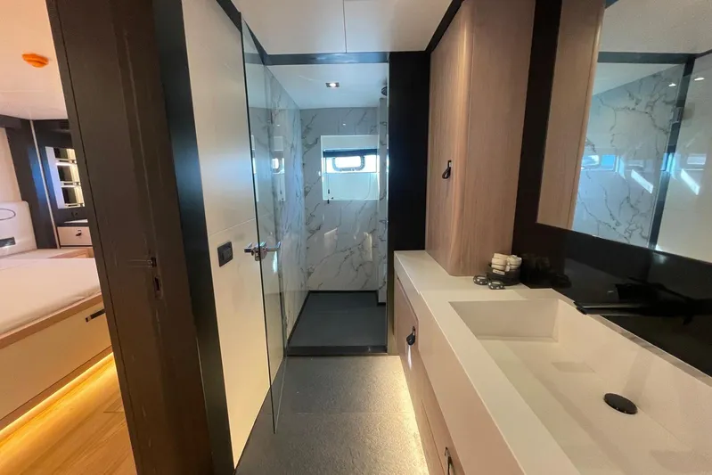  Yacht Photos Pics Luxurious 2024 Explorer ICE yacht bathroom with modern design and marble accents.