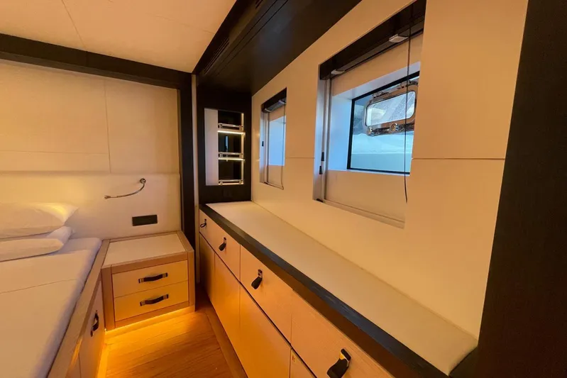 Yacht Photos Pics Luxurious 2024 Explorer ICE yacht interior with modern cabinetry and ambient lighting.