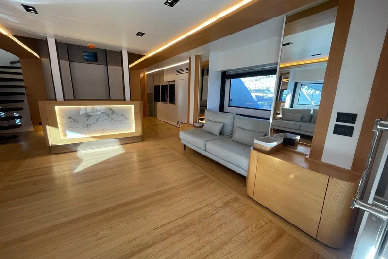  Yacht Photos Pics Luxurious 2024 Explorer ICE yacht interior with modern design, featuring wood flooring and elegant furnishings.