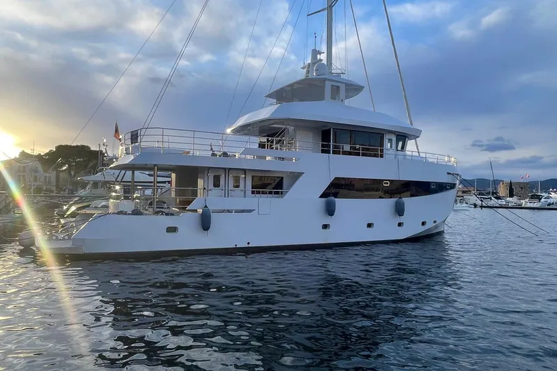  Yacht Photos Pics 2024 Explorer ICE yacht docked at sunset, showcasing sleek design and modern features.