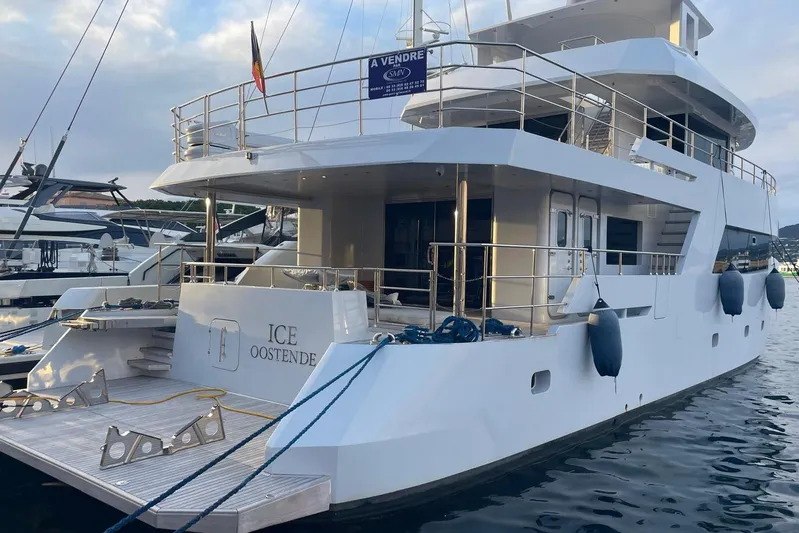  Yacht Photos Pics Luxury 2024 Explorer ICE yacht docked, featuring spacious decks and modern design.