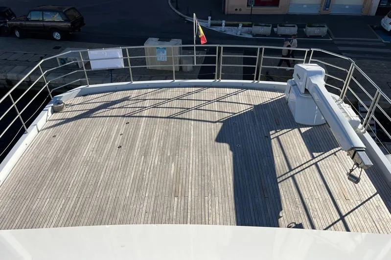  Yacht Photos Pics Spacious deck of 2024 Explorer ICE yacht with wooden flooring and railing.