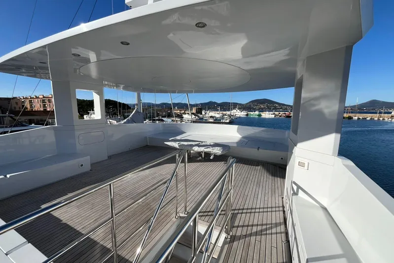  Yacht Photos Pics Luxurious 2024 Explorer ICE yacht deck with scenic marina view.