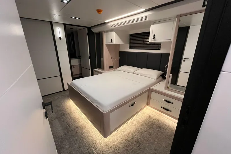  Yacht Photos Pics Luxurious 2024 Explorer ICE bedroom interior with modern design and ambient lighting.