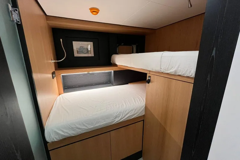  Yacht Photos Pics 2024 Explorer ICE interior with wooden bunk beds and modern design.
