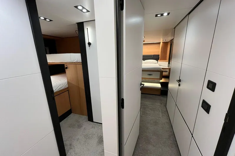  Yacht Photos Pics 2024 Explorer ICE interior with modern design, featuring bunk beds and a cozy bedroom.