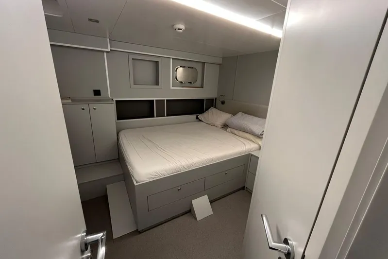  Yacht Photos Pics 2024 Explorer ICE interior cabin with bed, storage, and modern design.