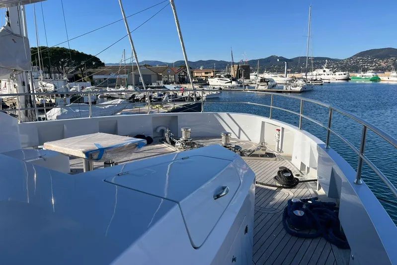  Yacht Photos Pics 2024 Explorer ICE yacht docked at a marina with scenic mountain views.