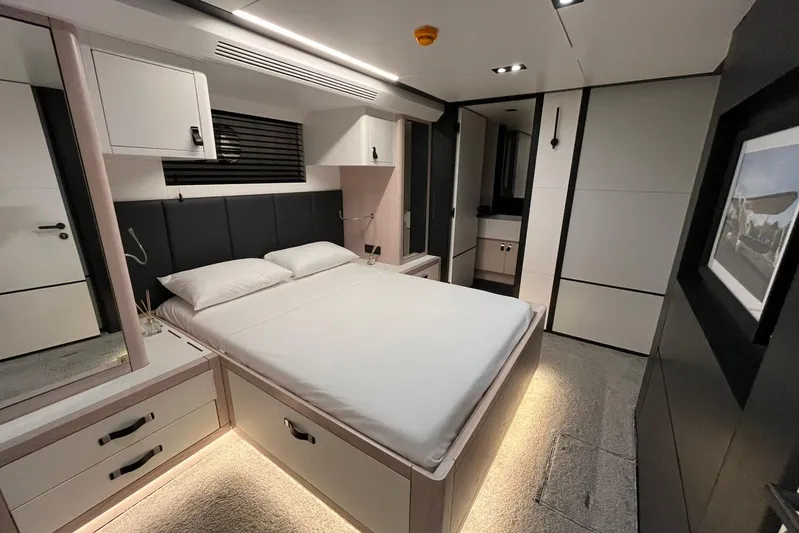  Yacht Photos Pics Luxurious 2024 Explorer ICE bedroom interior with modern design and ambient lighting.