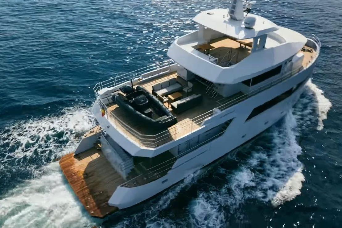 Luxurious 2024 Explorer ICE yacht cruising on open sea, showcasing elegant design and spacious decks.