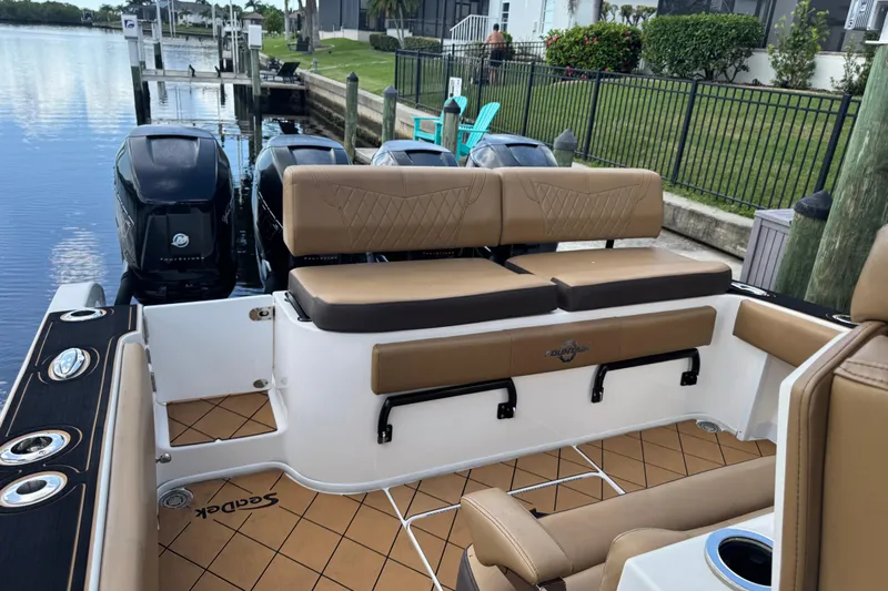  Yacht Photos Pics 2020 Fountain 38 Center Console boat with tan seating and triple outboard engines.