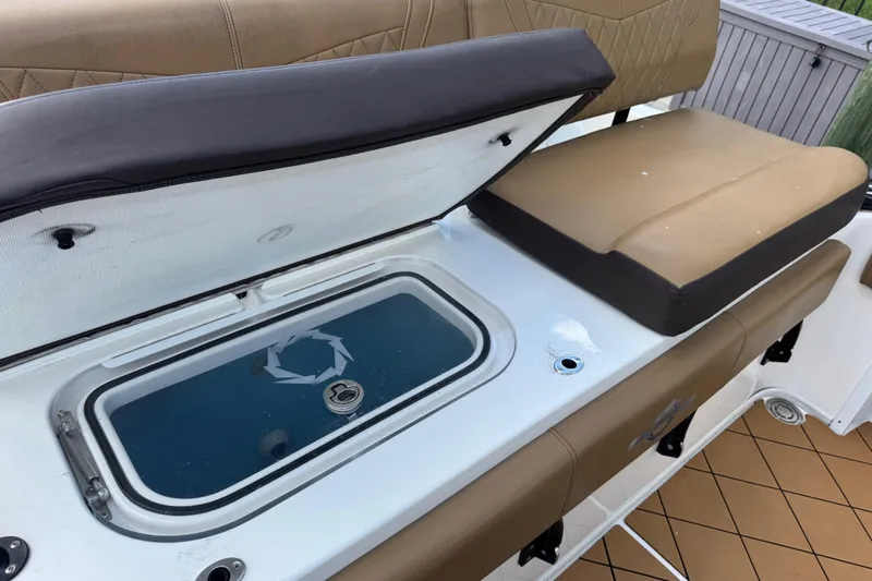  Yacht Photos Pics 2020 Fountain 38 Center Console boat seat with open storage compartment.