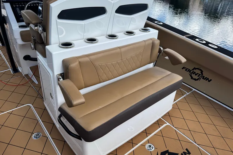  Yacht Photos Pics 2020 Fountain 38 Center Console boat interior with tan seating and cup holders.