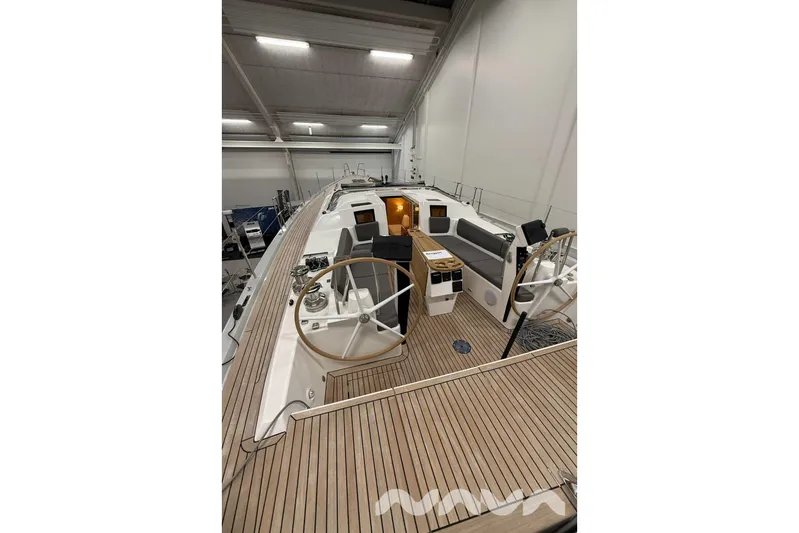  Yacht Photos Pics 2024 X-Yachts Xc 47 sailboat interior with dual steering wheels and teak deck.