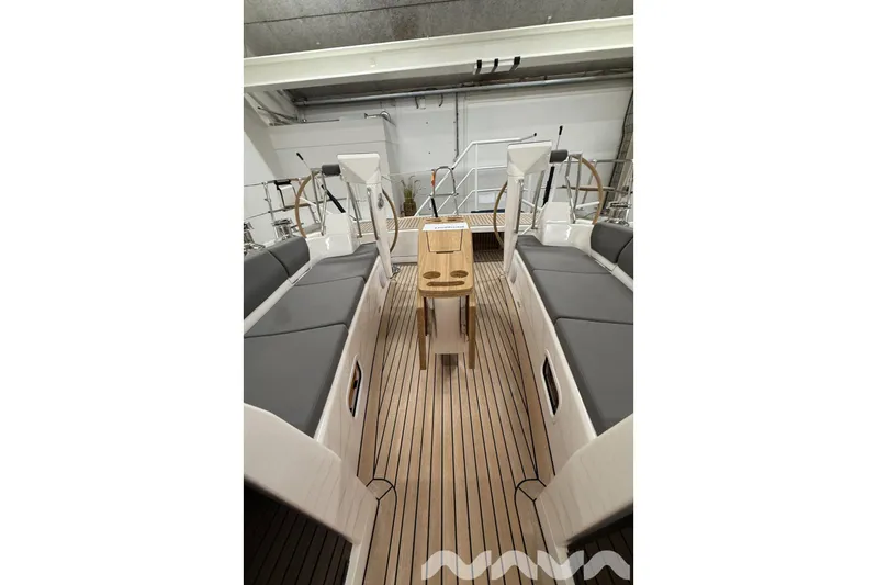  Yacht Photos Pics 2024 X-Yachts Xc 47 yacht interior with sleek wooden deck and modern seating.