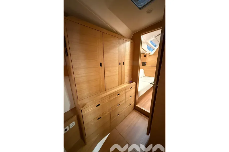  Yacht Photos Pics 2024 X-Yachts Xc 47 interior with wooden cabinetry and modern design.