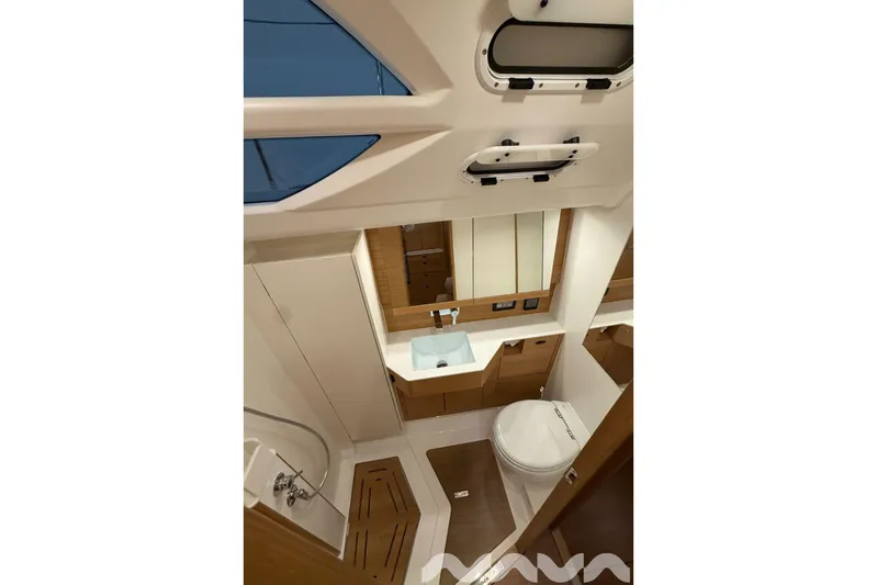  Yacht Photos Pics 2024 X-Yachts Xc 47 yacht bathroom with modern fixtures and wooden accents.