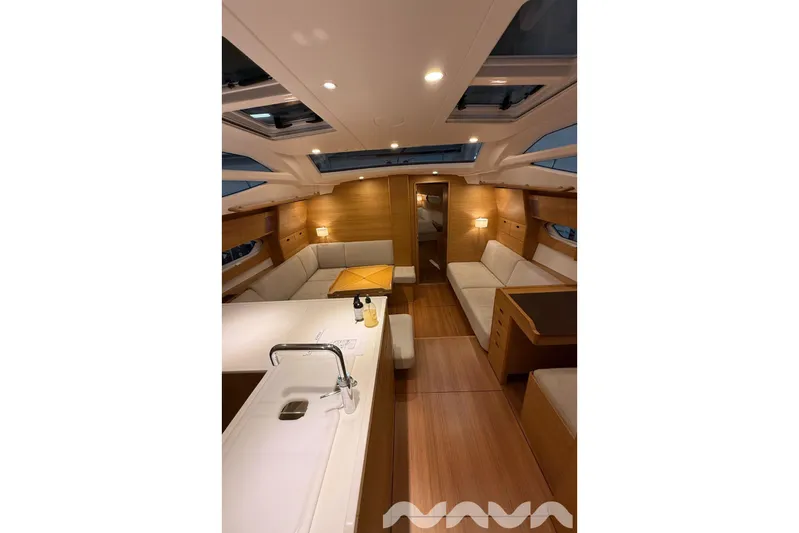  Yacht Photos Pics Luxurious interior of 2024 X-Yachts Xc 47, featuring elegant wood finishes and modern design.