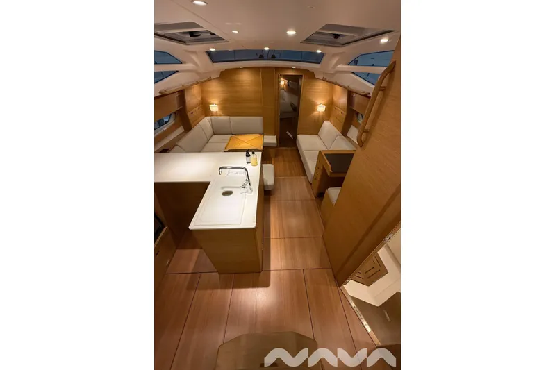  Yacht Photos Pics Luxurious interior of 2024 X-Yachts Xc 47, featuring elegant wood finishes and modern design.