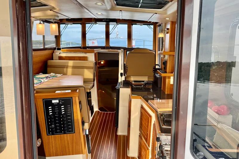  Yacht Photos Pics Interior of 2025 Ranger Tugs R-31 CB, featuring elegant wood finishes and modern amenities.