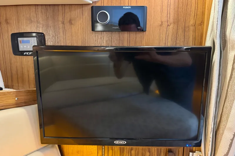  Yacht Photos Pics 2025 Ranger Tugs R-31 CB interior with Jensen TV and Fusion audio system.